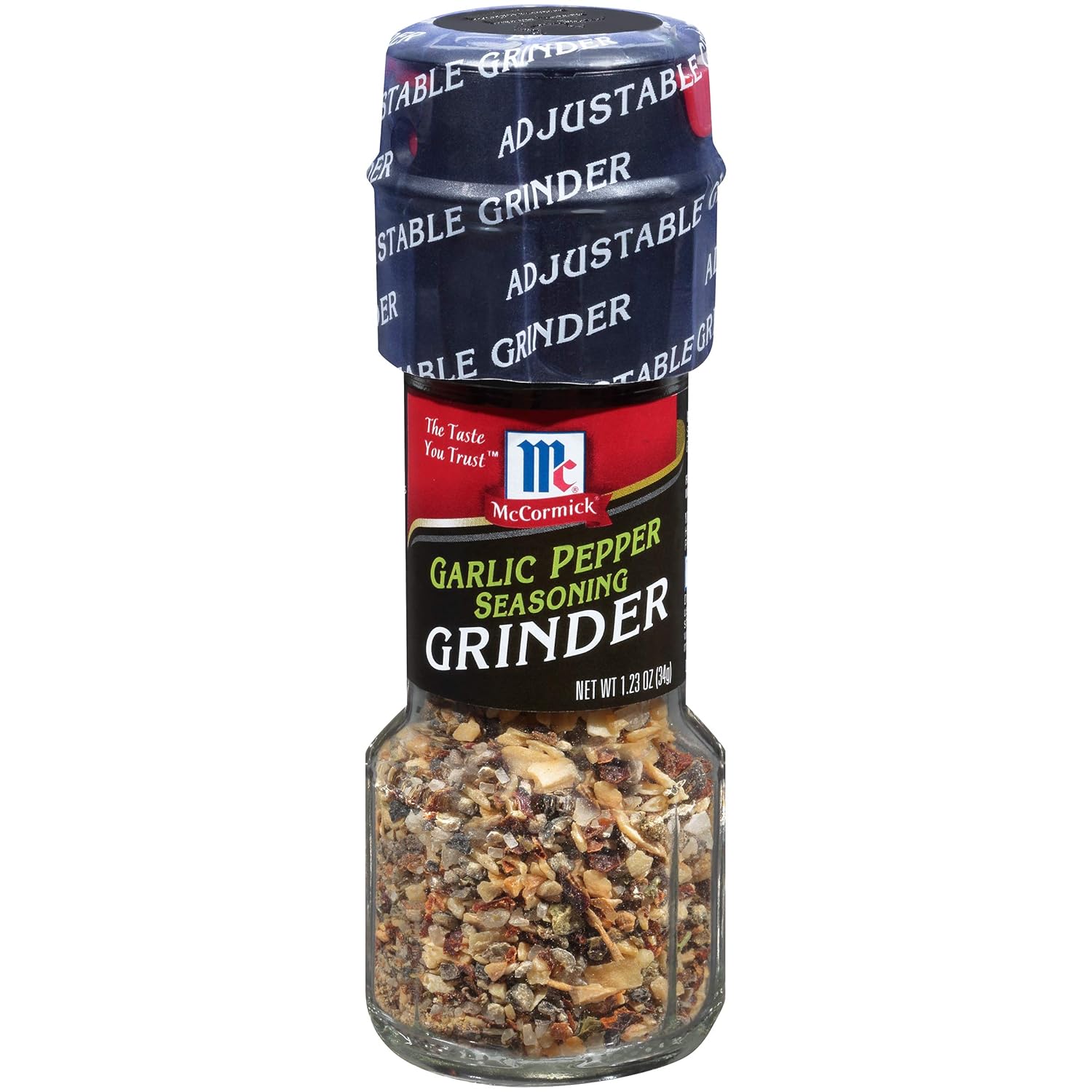 Real-life context showing the garlic powder seasoning jar opened on a kitchen counter with measuring spoons and fresh herbs